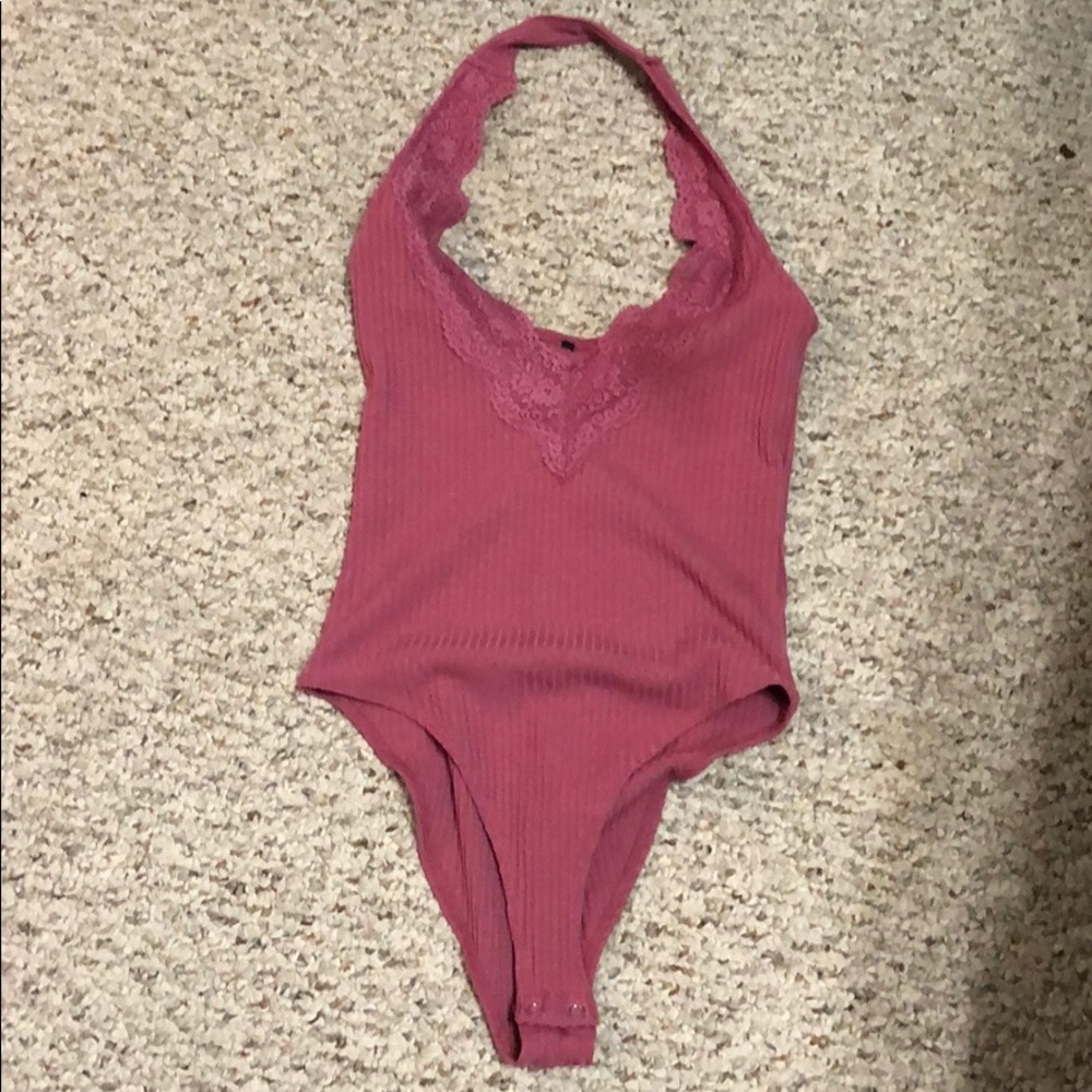 Fitted pink body suit